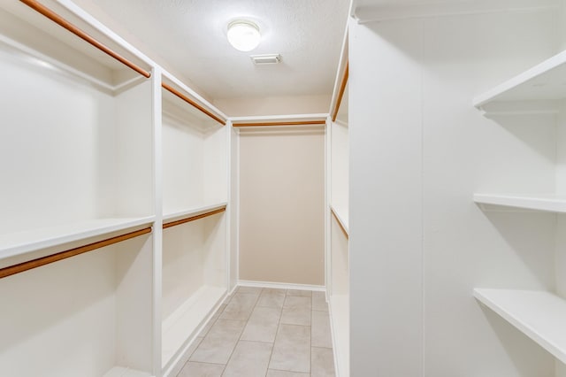 341 Sam, Houston Loop, Point Blank, TX 77364 - spacious closet featuring light tile patterned flooring