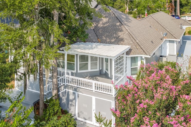 341 Sam, Houston Loop, Point Blank, TX 77364 - rear view of property with a sunroom