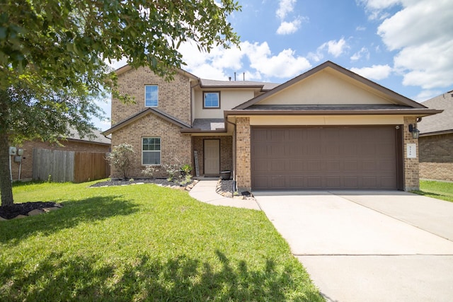 traditional home featuring driveway, an attached garage, brick siding, and stucco siding