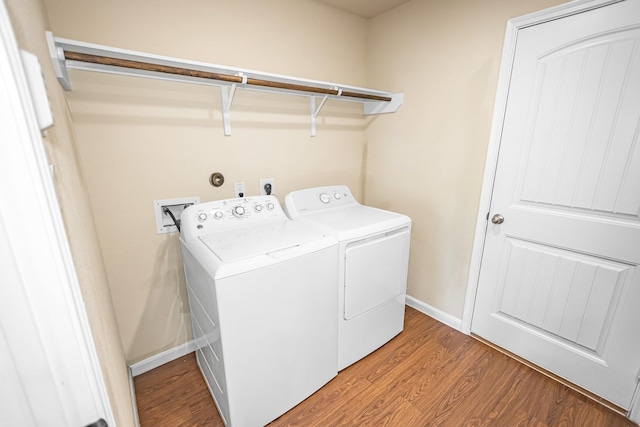 9726 Shimmering Lakes Dr, Rosharon, TX 77583 - laundry room featuring washer and dryer, light wood-style floors, and baseboards