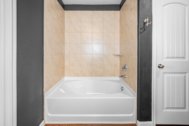 bathroom featuring washtub / shower combination