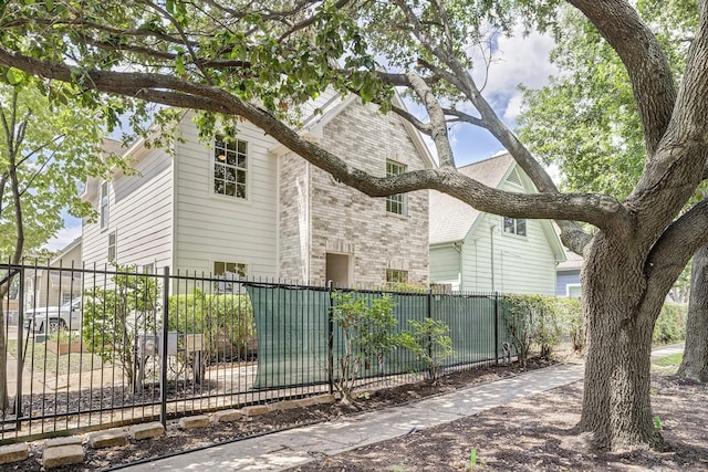 2802 Austin St, Houston, TX 77004 - view of property exterior featuring a fenced front yard and brick siding
