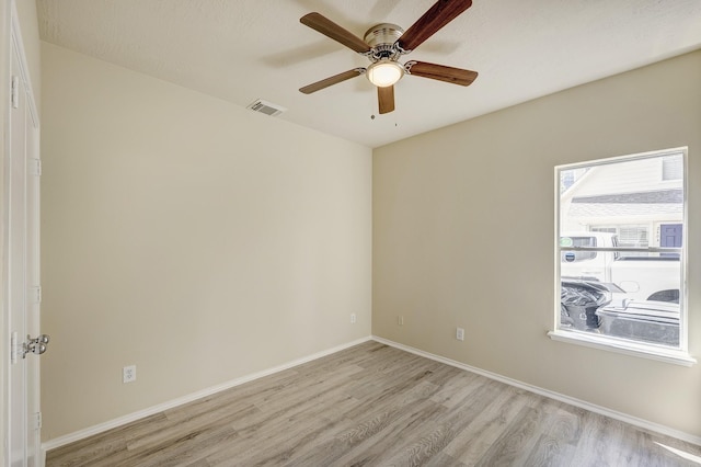 2802 Austin St, Houston, TX 77004 - empty room featuring light wood finished floors, ceiling fan, and baseboards