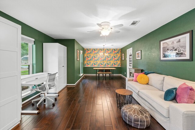 5918 Donwhite Ln, Houston, TX 77088 - living room with ceiling fan, dark wood finished floors, baseboards, and an accent wall