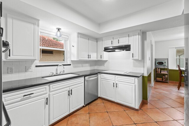 5918 Donwhite Ln, Houston, TX 77088 - kitchen featuring dishwasher, a sink, dark countertops, and under cabinet range hood