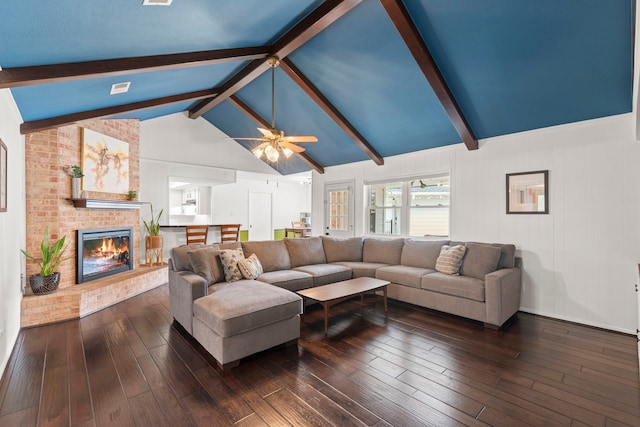 5918 Donwhite Ln, Houston, TX 77088 - living area with a ceiling fan, a brick fireplace, and dark wood-style floors