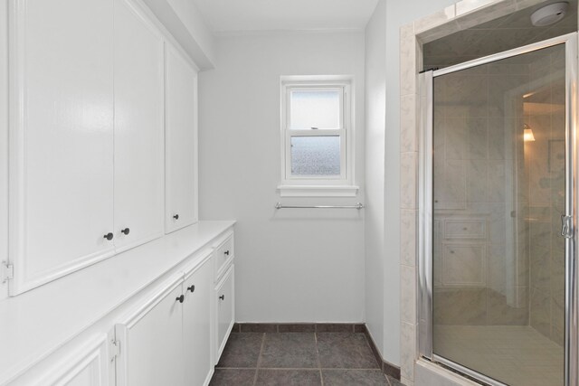 5918 Donwhite Ln, Houston, TX 77088 - bathroom featuring baseboards and a stall shower