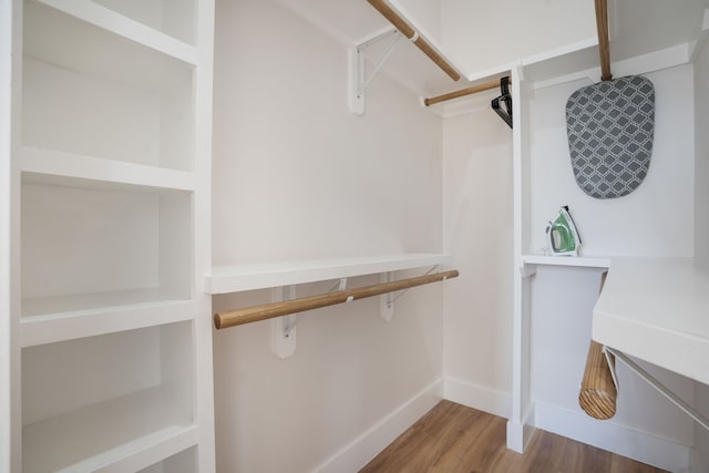 7612 Ave L, Houston, TX 77012 - walk in closet featuring wood finished floors