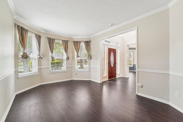 2422 Acadiana Ln, Seabrook, TX 77586 - unfurnished room with baseboards, ornamental molding, dark wood finished floors, and a textured ceiling