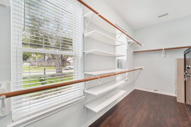 2422 Acadiana Ln, Seabrook, TX 77586 - walk in closet with dark wood-type flooring