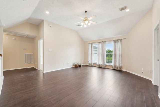 2422 Acadiana Ln, Seabrook, TX 77586 - unfurnished living room featuring vaulted ceiling, a ceiling fan, a textured ceiling, dark wood-style flooring, and baseboards