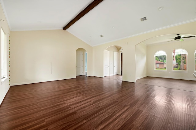 unfurnished living room featuring a ceiling fan, dark wood-type flooring, baseboards, arched walkways, and crown molding