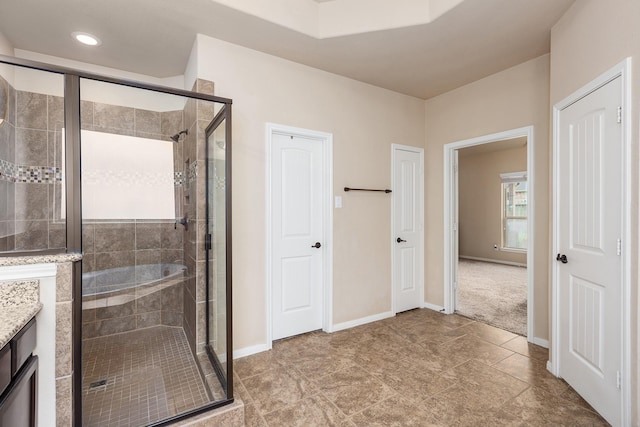18107 Banpo Ct, Houston, TX 77044 - bathroom with a stall shower, vanity, baseboards, and recessed lighting