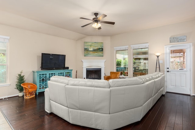 18107 Banpo Ct, Houston, TX 77044 - living area featuring a ceiling fan, dark wood-style flooring, healthy amount of natural light, and a fireplace