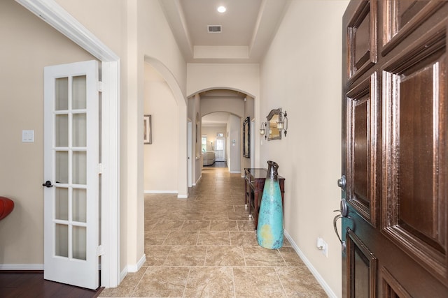 18107 Banpo Ct, Houston, TX 77044 - hallway featuring arched walkways and baseboards