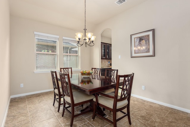 18107 Banpo Ct, Houston, TX 77044 - dining space with a chandelier, arched walkways, and baseboards
