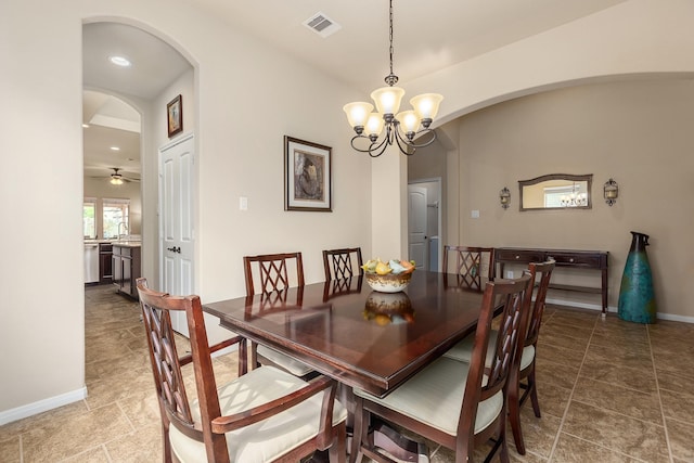 18107 Banpo Ct, Houston, TX 77044 - dining room featuring arched walkways, a chandelier, baseboards, and recessed lighting