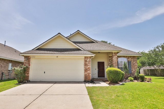 2202 Sugar Hill Dr, Deer Park, TX 77536 - traditional home with brick siding, roof with shingles, driveway, and a garage