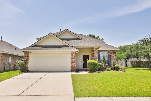 2202 Sugar Hill Dr, Deer Park, TX 77536 - traditional-style home featuring an attached garage, brick siding, roof with shingles, and driveway