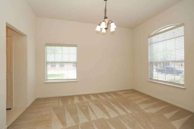 2202 Sugar Hill Dr, Deer Park, TX 77536 - spare room featuring a chandelier, light carpet, and baseboards