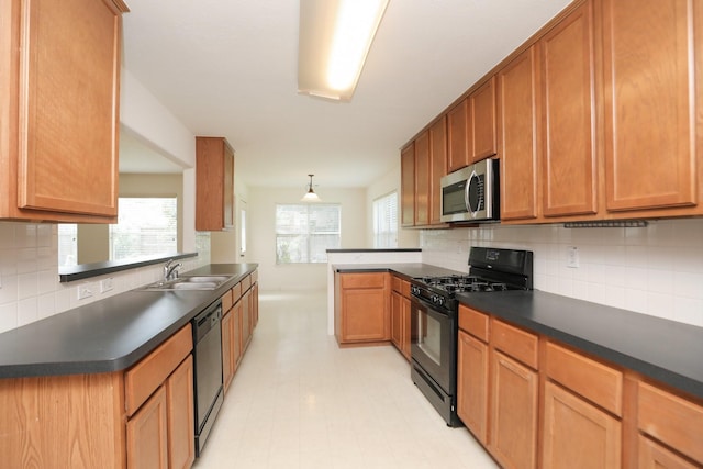 2202 Sugar Hill Dr, Deer Park, TX 77536 - kitchen featuring black appliances, dark countertops, a sink, and tasteful backsplash
