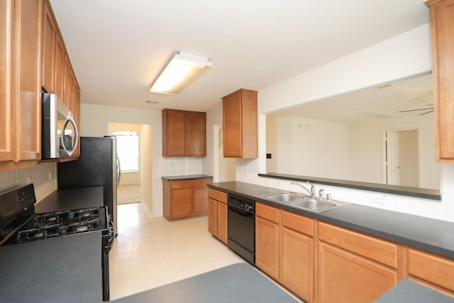 2202 Sugar Hill Dr, Deer Park, TX 77536 - kitchen with black appliances, a sink, tasteful backsplash, and dark countertops