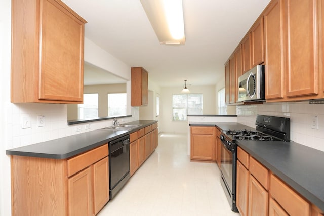 2202 Sugar Hill Dr, Deer Park, TX 77536 - kitchen with black appliances, a sink, dark countertops, and tasteful backsplash