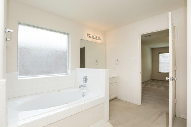 2202 Sugar Hill Dr, Deer Park, TX 77536 - full bathroom featuring a jetted tub, vanity, and baseboards