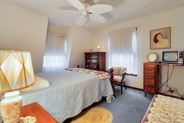 204 Rd 2764, Rye, TX 77327 - bedroom featuring multiple windows, carpet floors, baseboards, and a ceiling fan