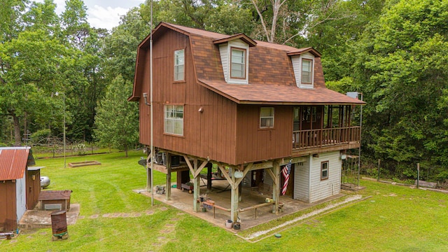 204 Rd 2764, Rye, TX 77327 - rear view of property featuring a patio area, roof with shingles, a yard, and view of scattered trees