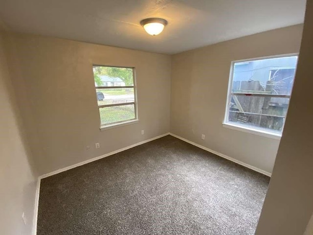 10110 Rosehaven Dr, Houston, TX 77051 - empty room with dark carpet and baseboards