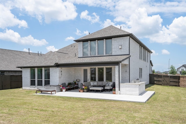7507 Zion Grove Ct, Katy, TX 77493 - back of house featuring outdoor lounge area, brick siding, a patio, and a gate