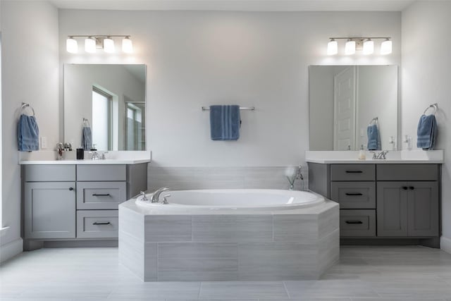7507 Zion Grove Ct, Katy, TX 77493 - full bath featuring tile patterned floors, a bath, two vanities, and a stall shower