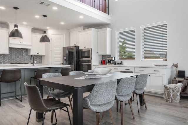 7507 Zion Grove Ct, Katy, TX 77493 - dining area featuring light wood-style flooring and recessed lighting