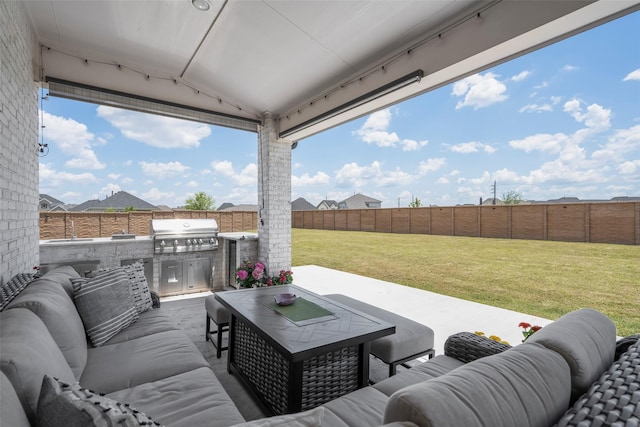 7507 Zion Grove Ct, Katy, TX 77493 - view of patio featuring area for grilling, an outdoor living space, and an outdoor kitchen
