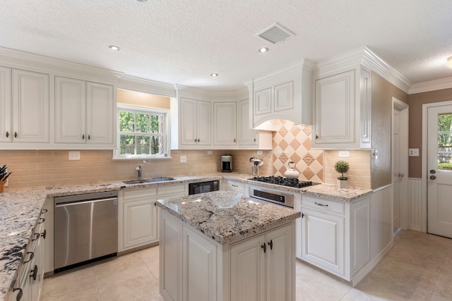 5407 Westminister Ct, Houston, TX 77069 - kitchen with dishwasher, a sink, healthy amount of natural light, light tile patterned floors, and a textured ceiling