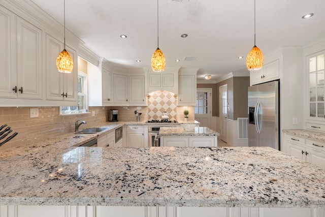 5407 Westminister Ct, Houston, TX 77069 - kitchen featuring stainless steel fridge with ice dispenser, a sink, light stone countertops, crown molding, and healthy amount of natural light