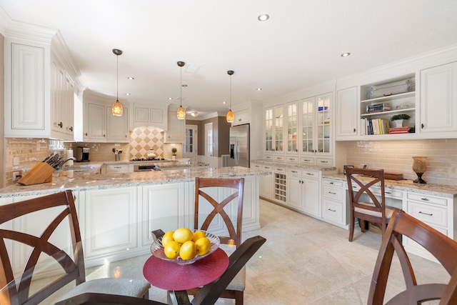 5407 Westminister Ct, Houston, TX 77069 - kitchen with stainless steel refrigerator with ice dispenser, decorative backsplash, a peninsula, a sink, and glass insert cabinets