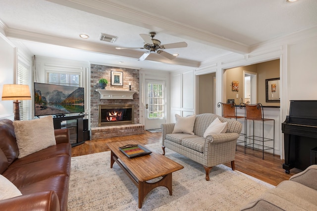 5407 Westminister Ct, Houston, TX 77069 - living room featuring crown molding, wood finished floors, a brick fireplace, ceiling fan, and recessed lighting