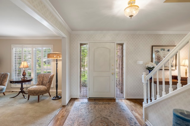 5407 Westminister Ct, Houston, TX 77069 - foyer entrance with ornamental molding, wallpapered walls, baseboards, and wood finished floors