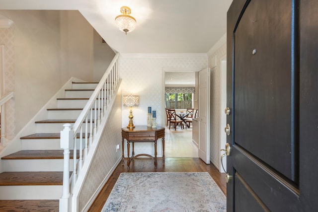 5407 Westminister Ct, Houston, TX 77069 - foyer entrance with wallpapered walls, stairway, dark wood-type flooring, and crown molding