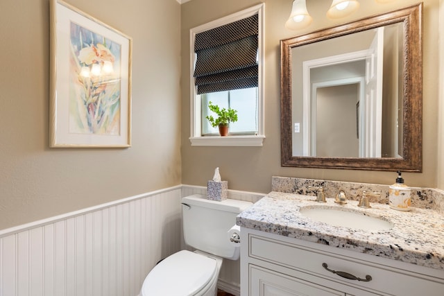 5407 Westminister Ct, Houston, TX 77069 - half bathroom featuring a wainscoted wall, vanity, and toilet