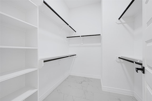 117 Big Spring Dr, Anahuac, TX 77514 - walk in closet featuring light marble finish floors