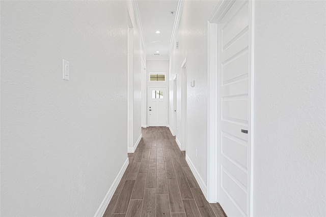 117 Big Spring Dr, Anahuac, TX 77514 - corridor featuring dark wood finished floors, baseboards, and crown molding