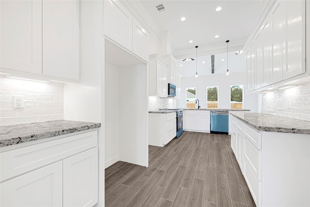 117 Big Spring Dr, Anahuac, TX 77514 - kitchen featuring dishwashing machine, range, decorative backsplash, light stone countertops, and light wood-style flooring