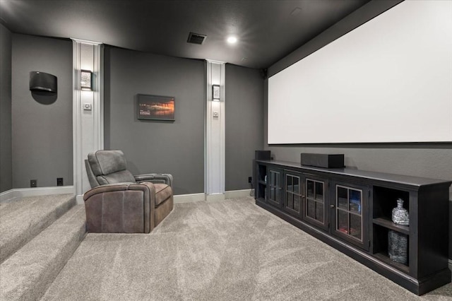 cinema with baseboards and carpet floors