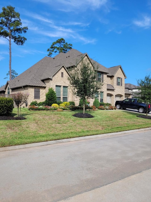 13402 Wedgewood Thicket Way, Cypress, TX 77429 - french country style house featuring a front lawn