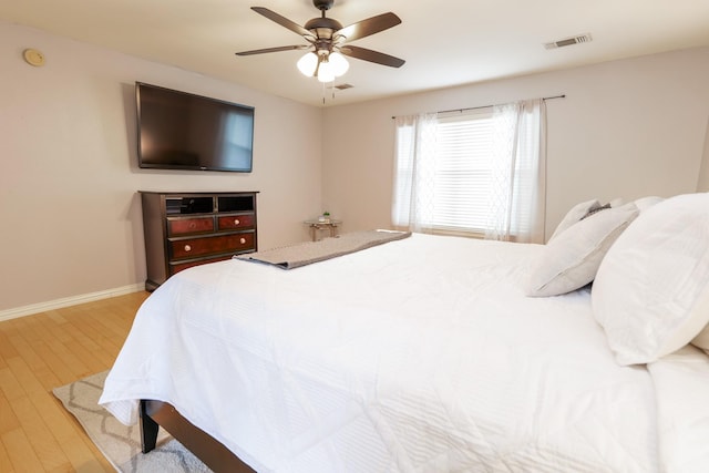 11606 Curry Ridge Ln, Tomball, TX 77377 - bedroom with wood finished floors, baseboards, and a ceiling fan
