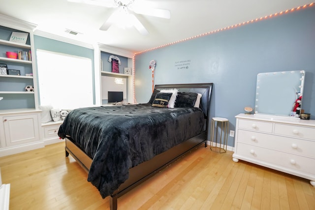 11606 Curry Ridge Ln, Tomball, TX 77377 - bedroom with light wood-style floors, ceiling fan, and baseboards