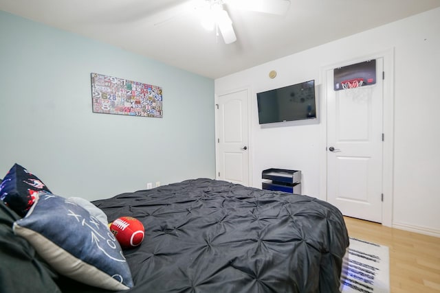 11606 Curry Ridge Ln, Tomball, TX 77377 - bedroom featuring light wood finished floors, ceiling fan, and baseboards